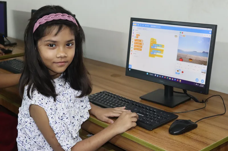 A young learner with her coding project at MyeKids